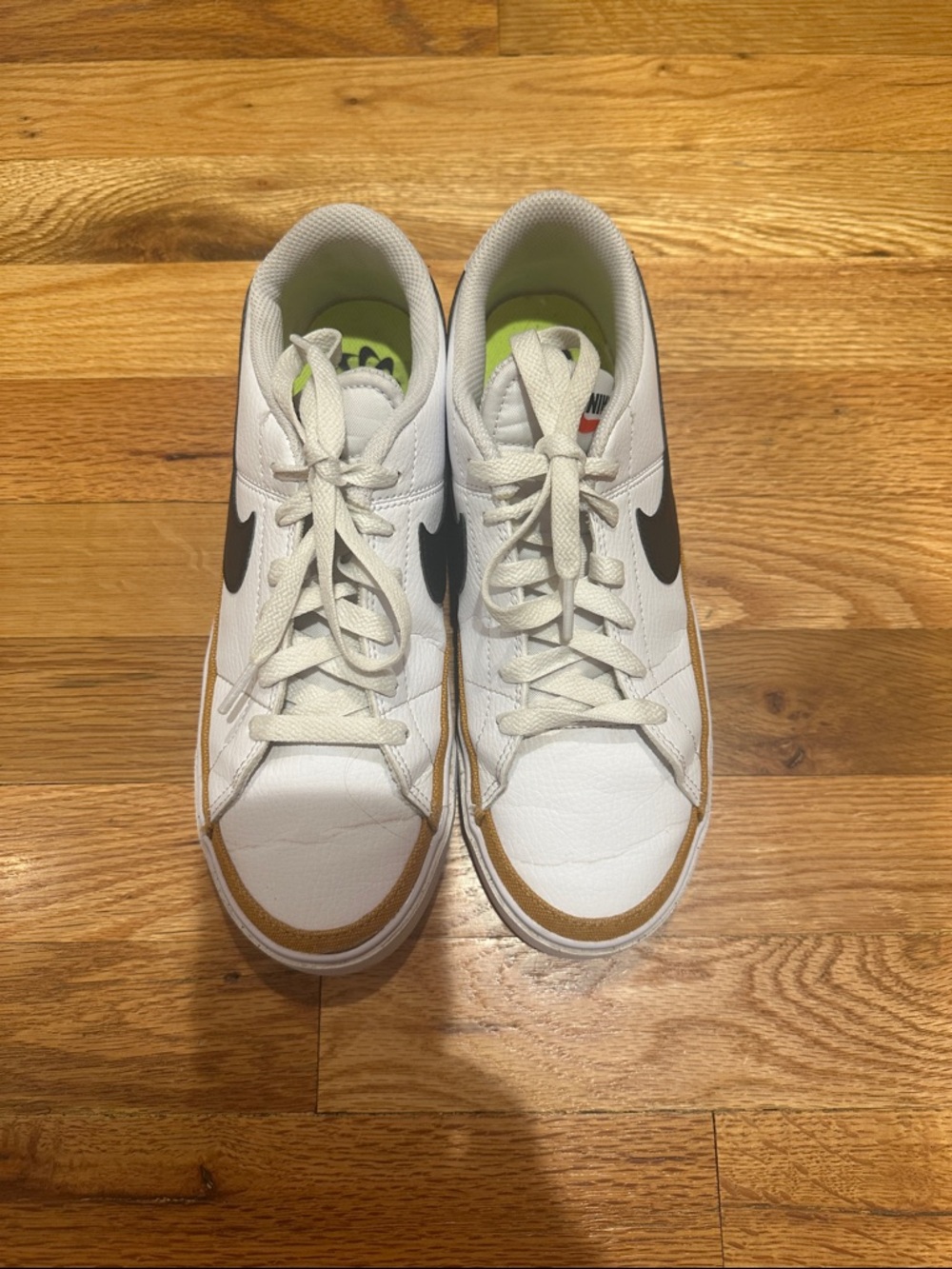 Nike White Low-Top Sneakers with Black Swoosh and Brown Accent very little wear
